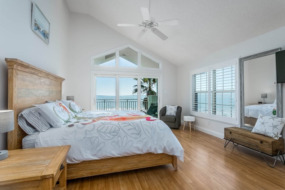Master bedroom. Third floor overlooking the beach, with private balcony.