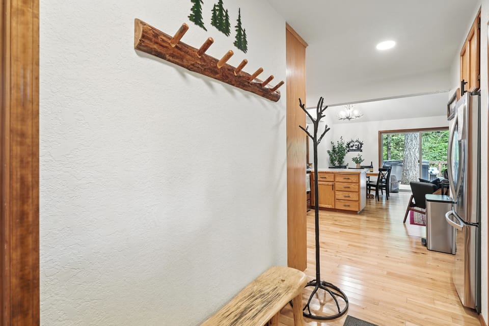 Entryway with plenty of space for coats and shoes.