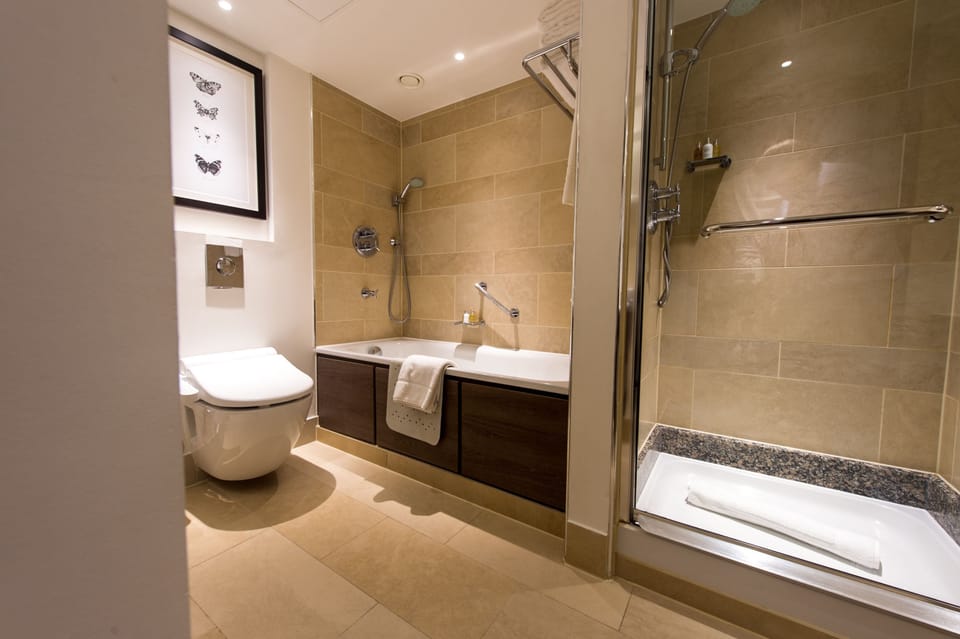 Regency, Executive Suite, 1 King Bed | Bathroom | Eco-friendly toiletries, hair dryer, bathrobes, slippers