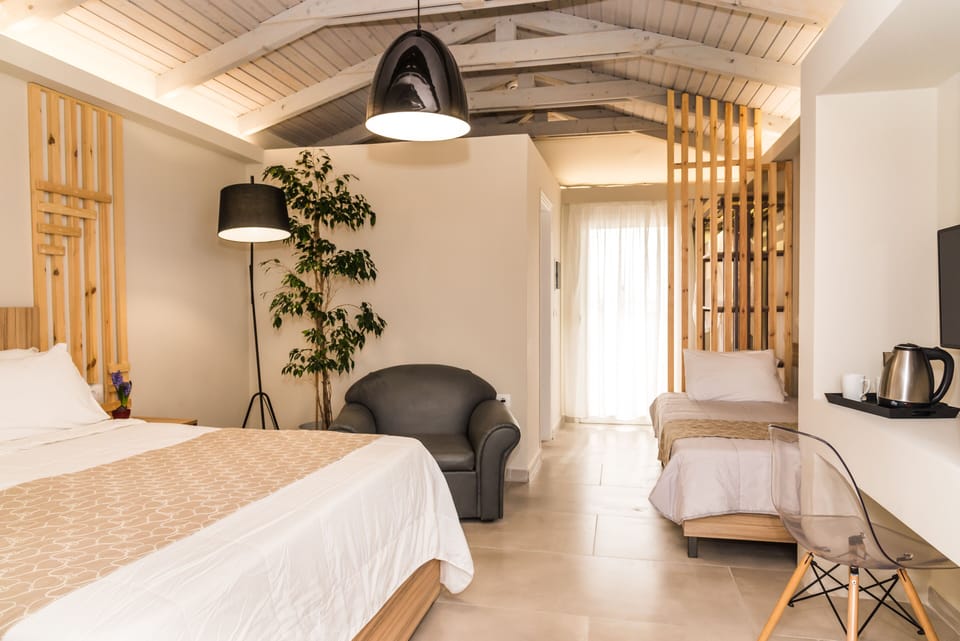 Junior Suite, Jetted Tub, Sea View | Individually decorated, desk, laptop workspace, iron/ironing board