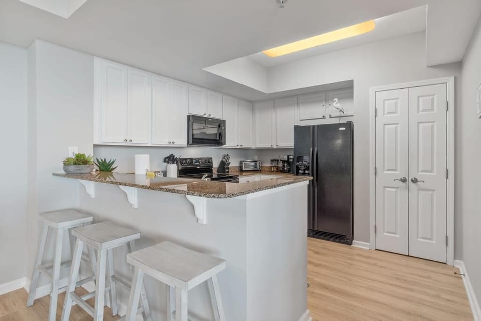Seating for 3 at the kitchen Island.