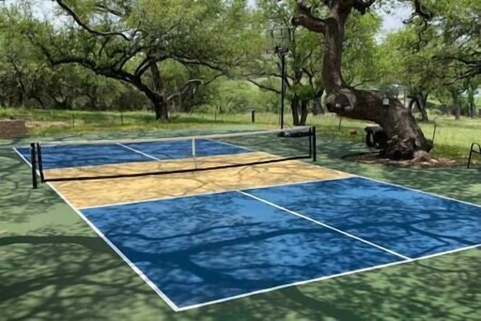 Pickle ball court and basketball hoop
