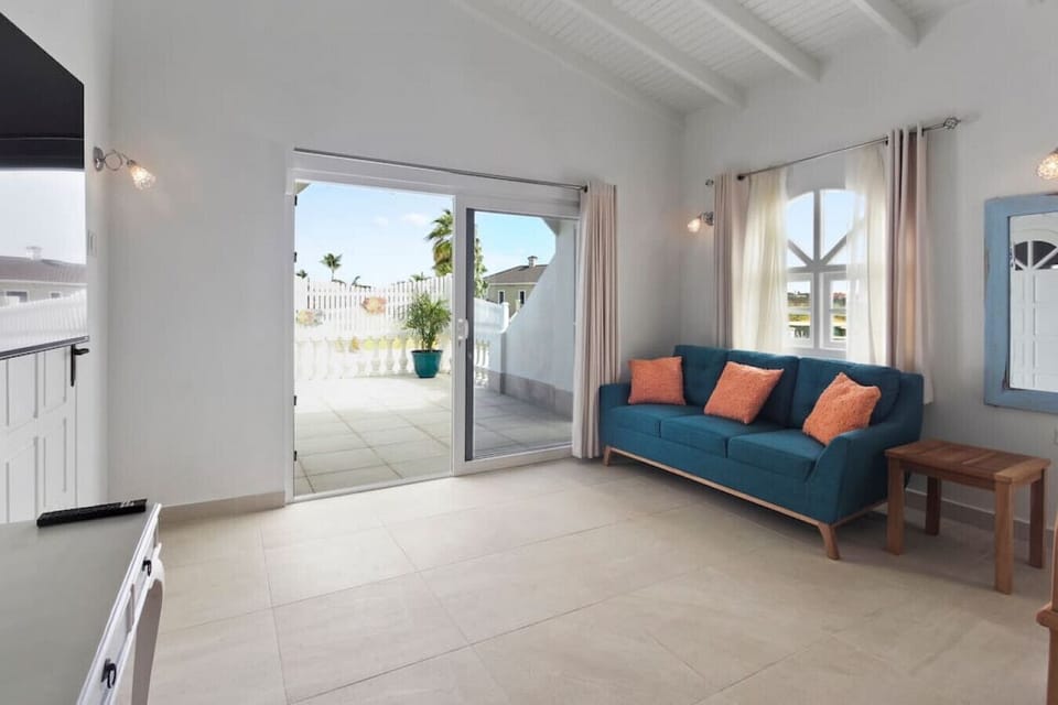 Relax in a bright sitting area with direct access to the private terrace.