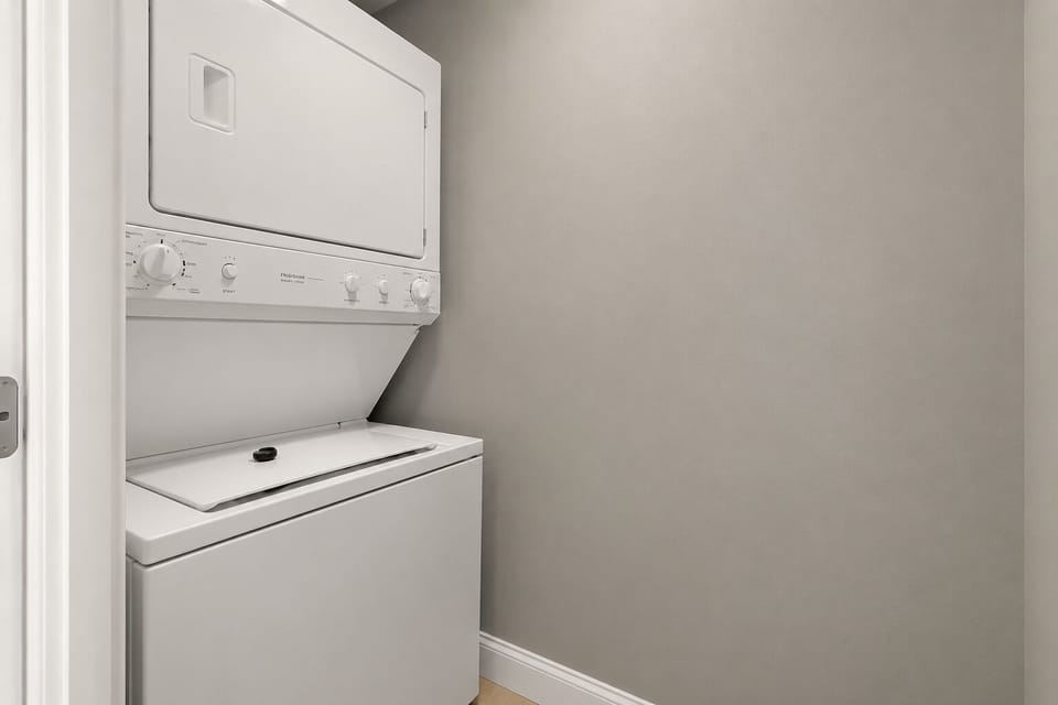 Laundry facilities connected via a closet in the kitchen.