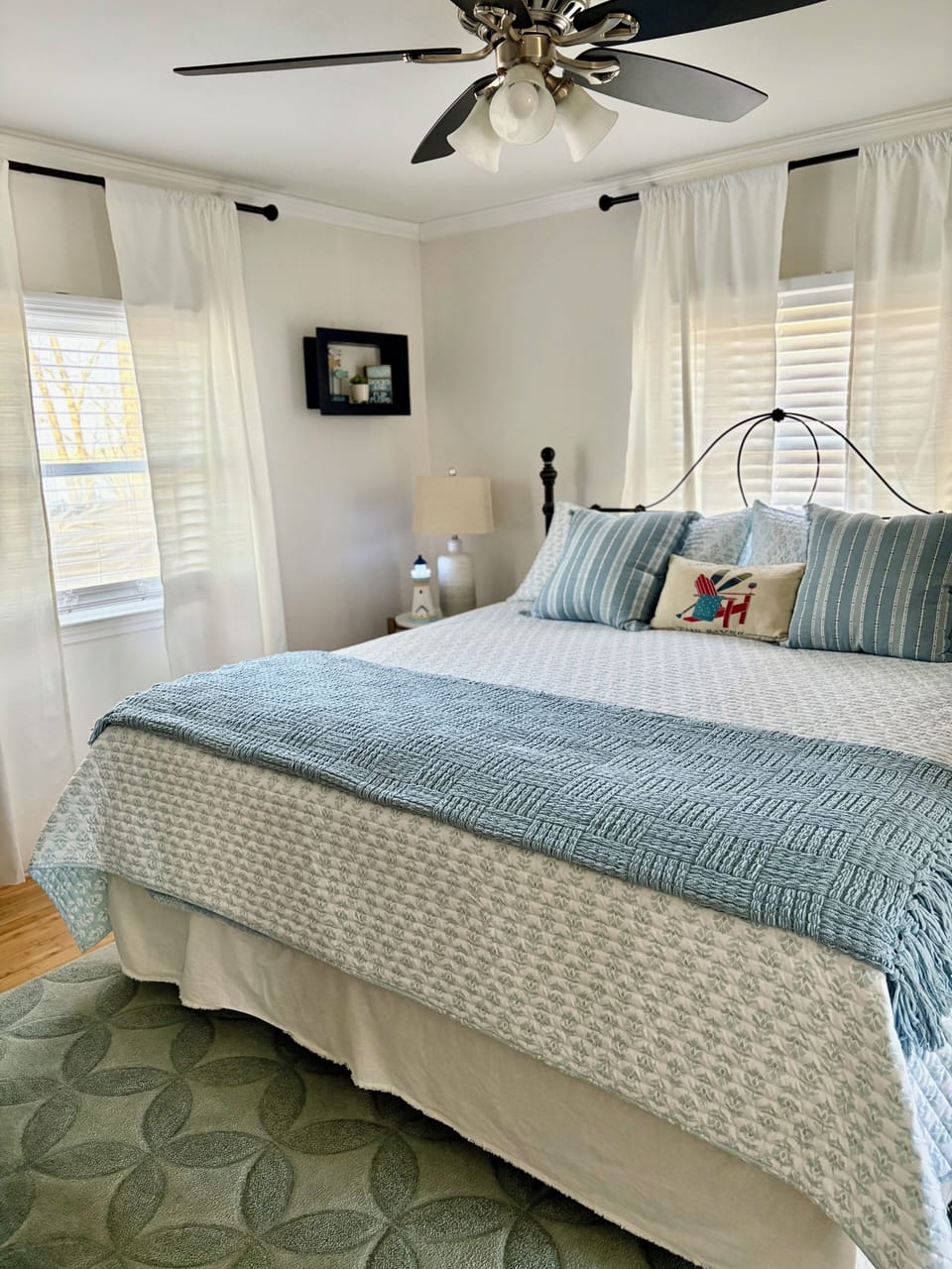 King bed in master suite with cozy bedding.