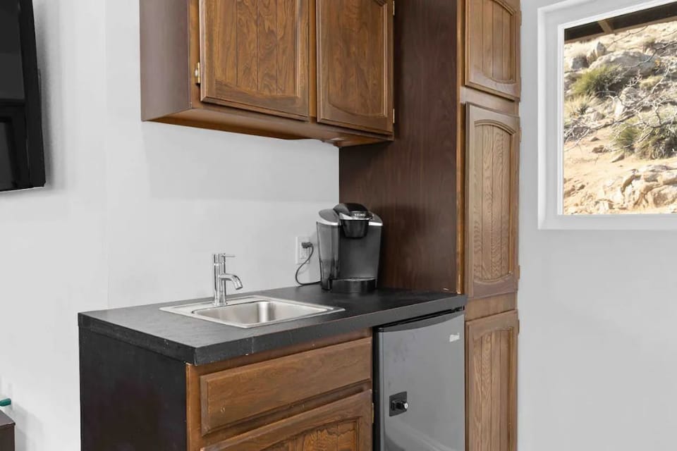 2nd floor kitchenette area with fridge and Keurig.