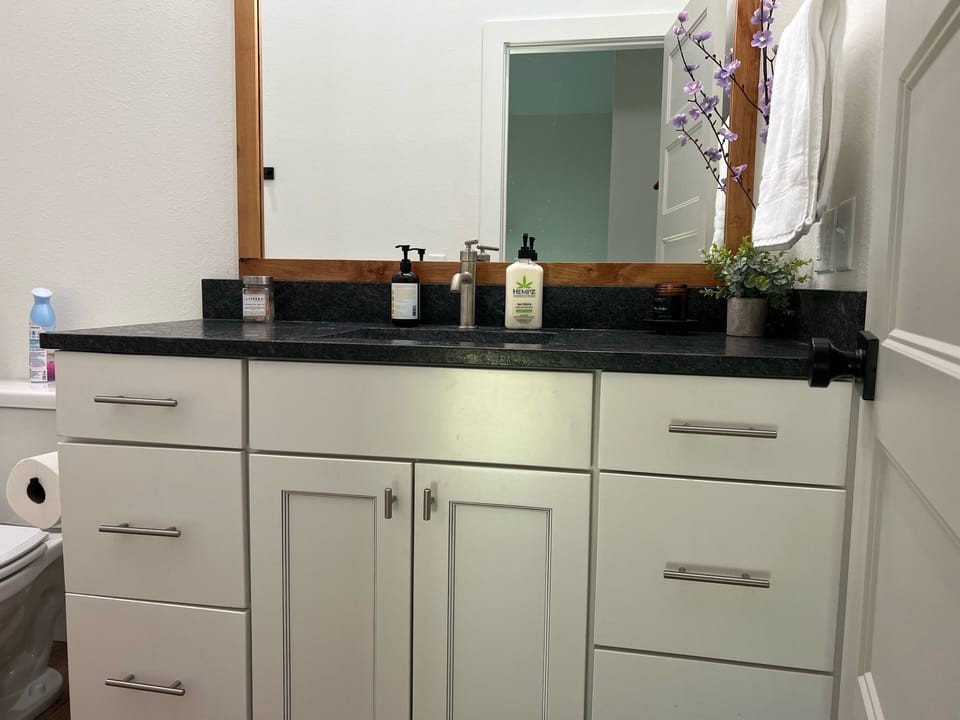 Upstairs Full Bath with granite countertops, and bath/shower combo.