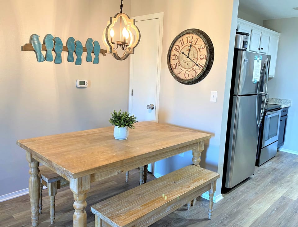 Dining area with farmhouse style table, chairs and bench seating