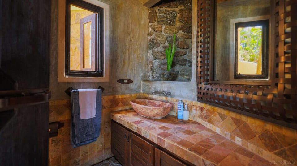 Charming rustic bathroom with natural stone accents.