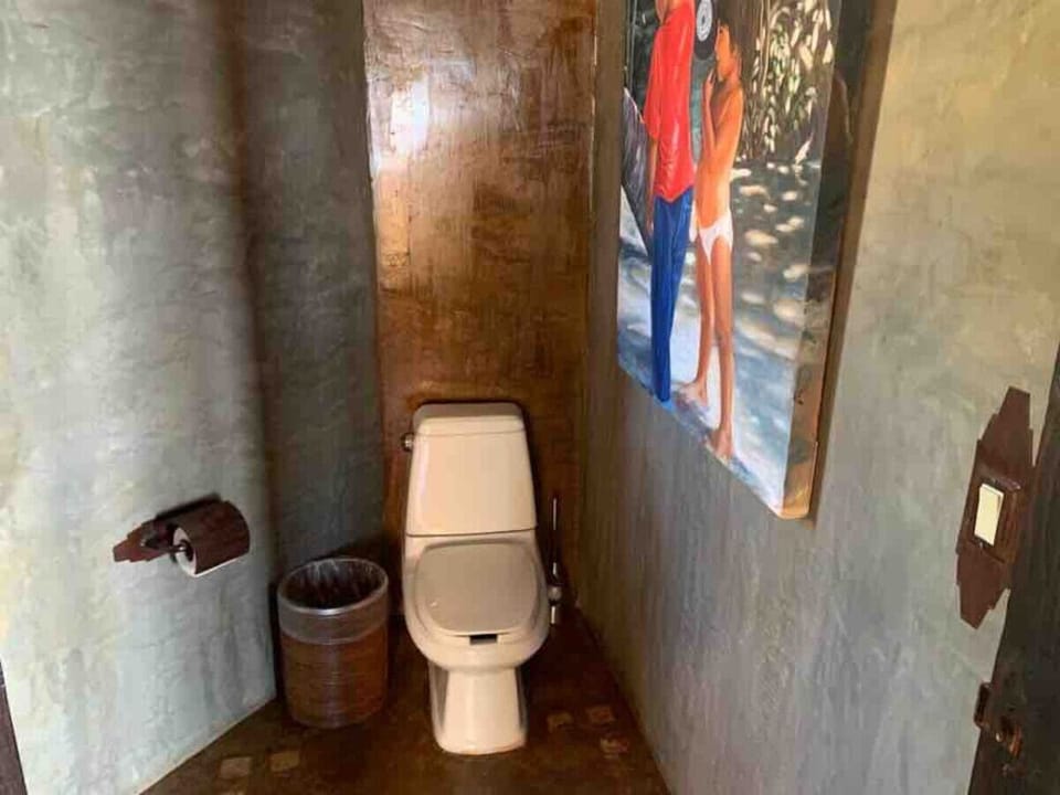 Cozy and artistic restroom space.