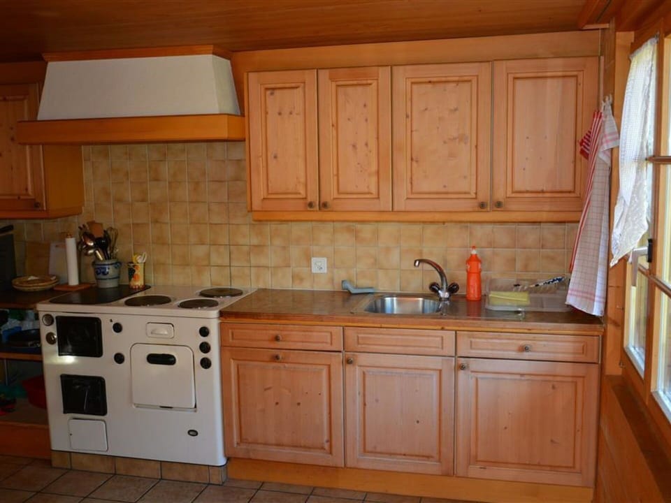 Cabinetry, Countertop, Building, Kitchen Sink, Wood, Kitchen, Flooring, Kitchen Stove, Floor, Kitchen Appliance