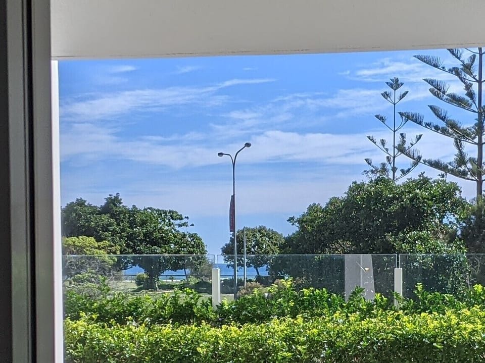 ocean glimpse through the garden 