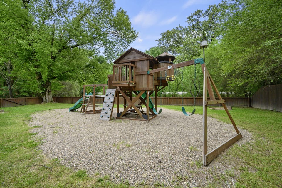Private playground in the backyard to entertain the younger ones 