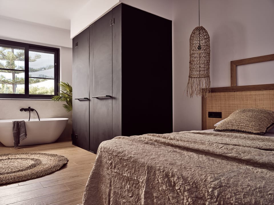 The master bedroom iconic design featuring a shower an in bedroom bathtub.