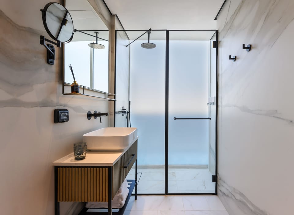 Double Room Urban View With Balcony | Bathroom | Shower, rainfall showerhead, towels