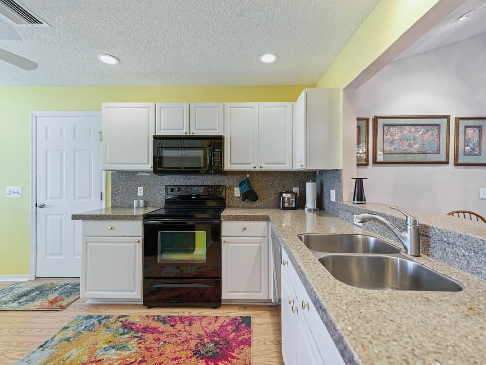 Double steel sinks, new Boesch dishwasher, disposal and more