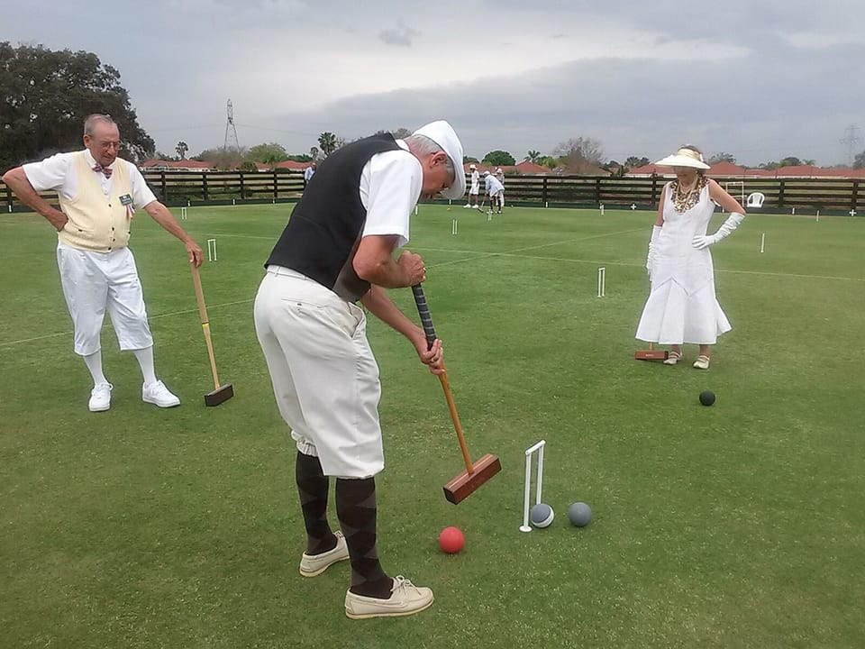 Neighbors Larry and Laura Bailey playing Tournament Croquet at a Gatsby Party