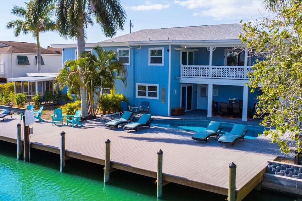 Heated pool with large outside deck area and boat dock
