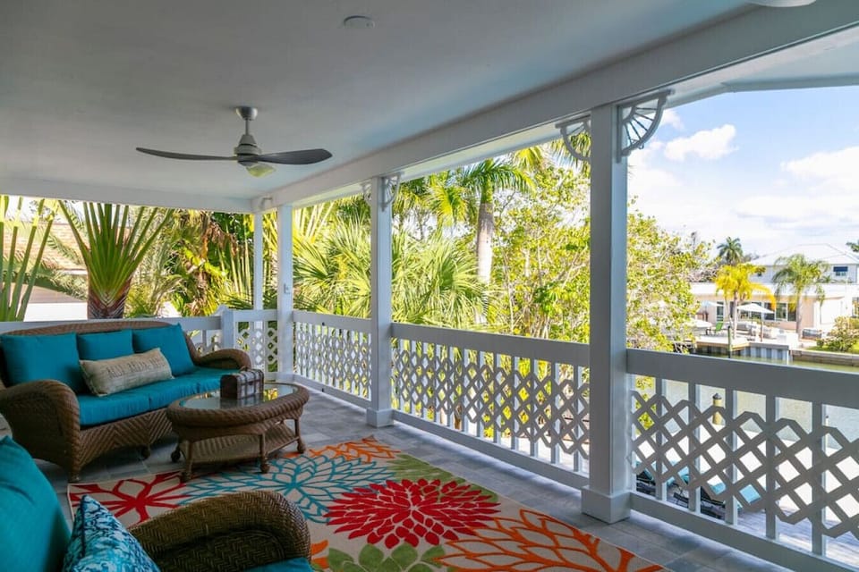 Peaceful balcony overlooking heated pool and deck area. Accessible from kitchen and living room patio doors.