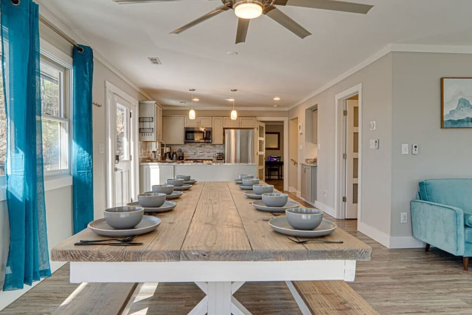 The dining room table overlooks the kitchen.