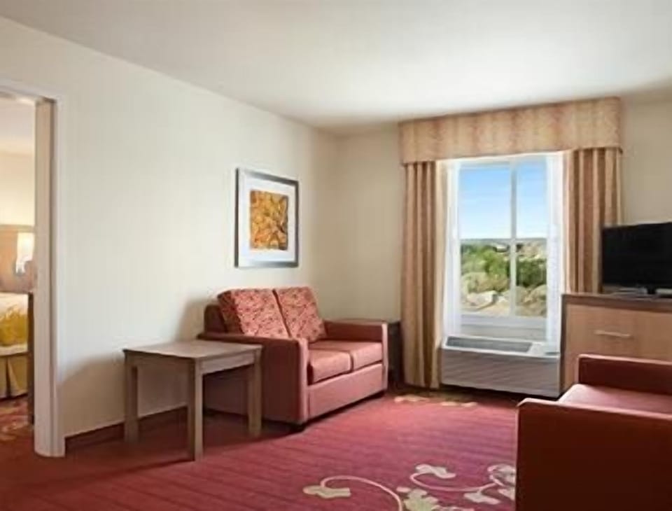 Desk, laptop workspace, blackout drapes, iron/ironing board