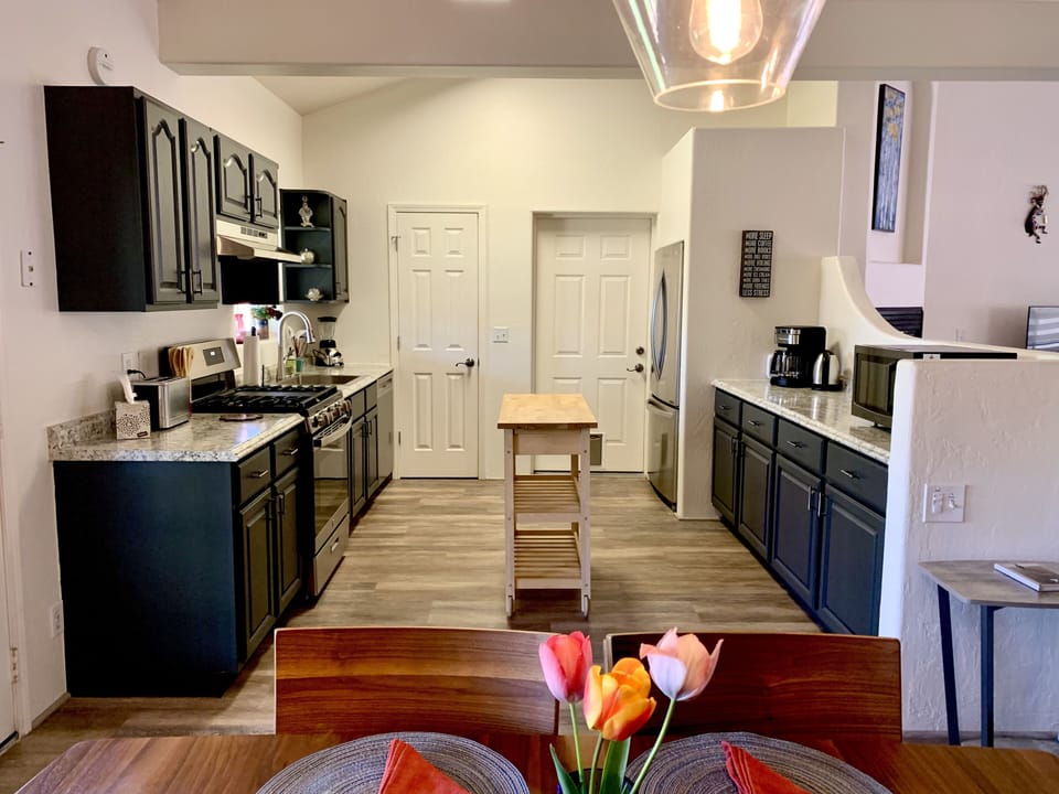 Kitchen from dining room w/flowers from garden
