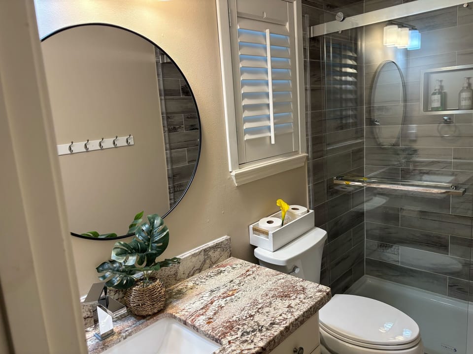 Freshen up in style in the spotless walk-in shower of our second bathroom.