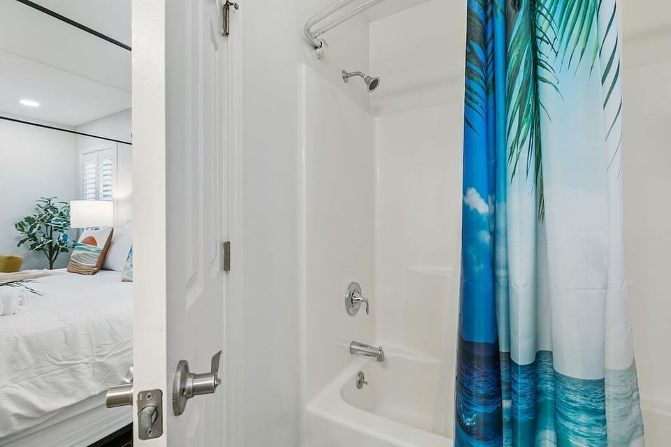 Enjoy both quick showers and soothing baths in the main ensuite bathroom’s tub and shower combo.
