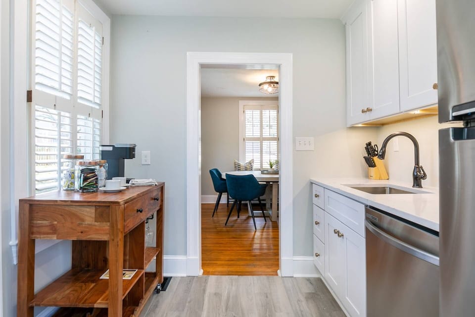 The fully-stocked kitchen is conveniently located next to the dining room.