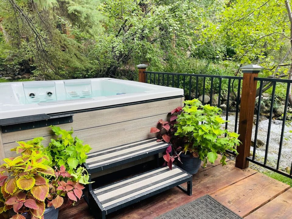 Outside hot tub overlooking the creek