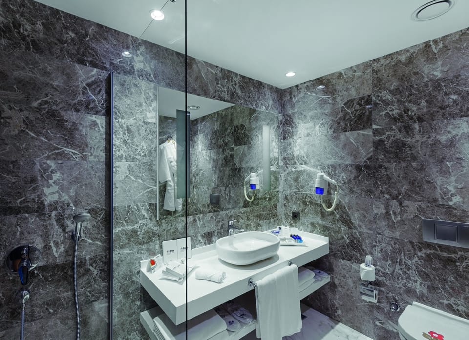 Premium Room, Sea View | Bathroom | Shower, hair dryer, slippers, towels