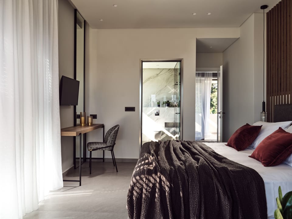 The master bedrooms features a dressing table and smart tv.