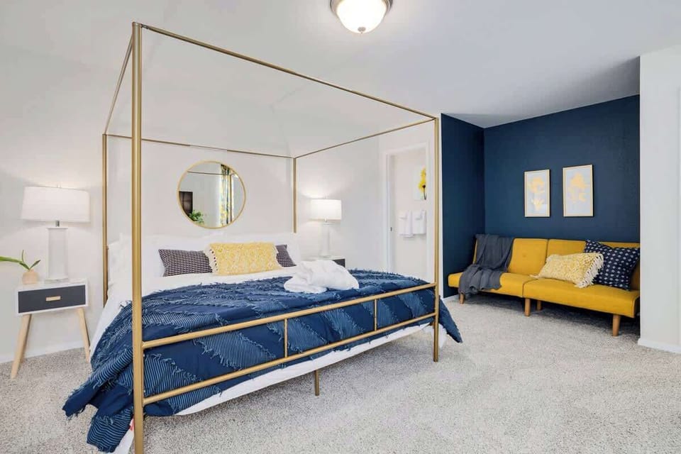 Our Master bedroom is complete with a King-size bed, Full fold-out bed, private seating area, closet, dresser, 44-inch TCL Roku TV and en suite bath.