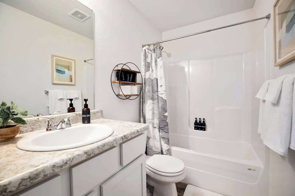 Our second bathroom sits between the two queen bedrooms and has a tub + shower, single sink and plenty of counter space.