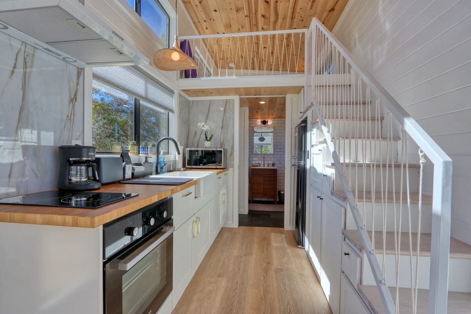 View looking through the kitchen toward the bathroom.