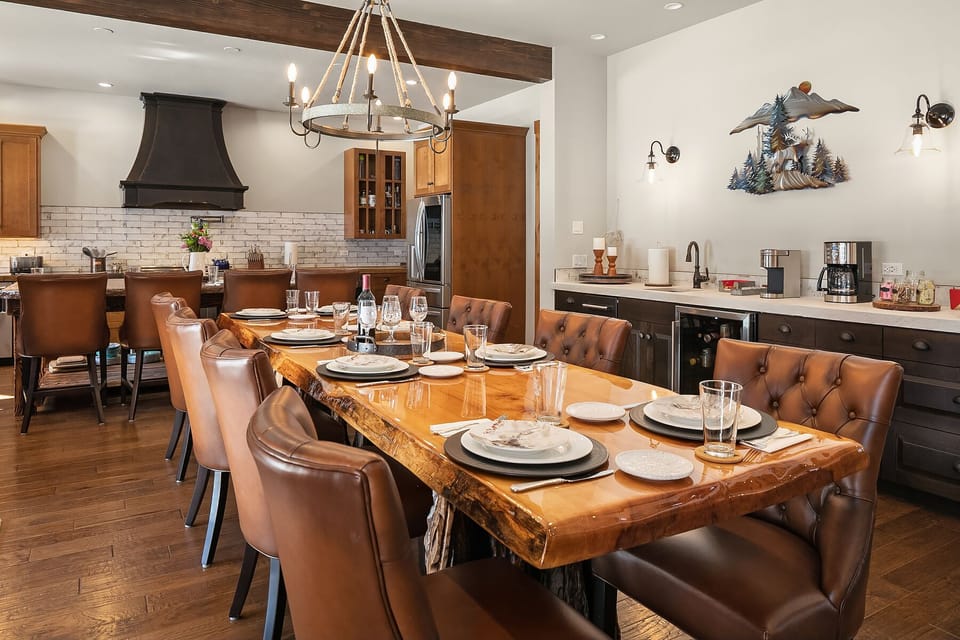 Grand Cascadian: - Custom wood dining table with seating for 10.