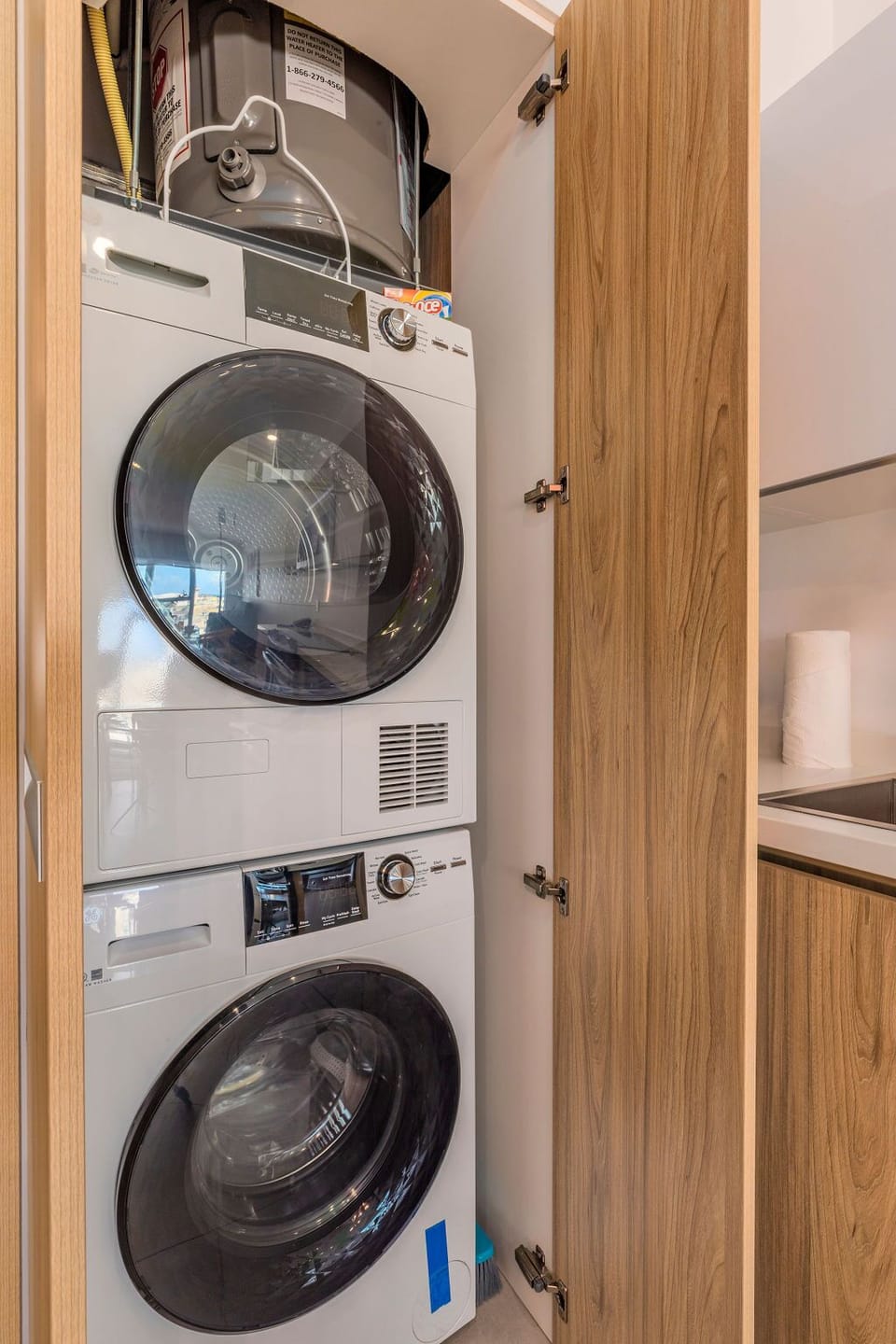 Your vacation laundry is handled with ease using your in-unit washer and dryer, stacked neatly in a tidy closet for convenience.