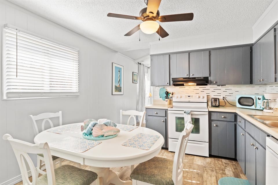 round beachy dining room with seating for 4