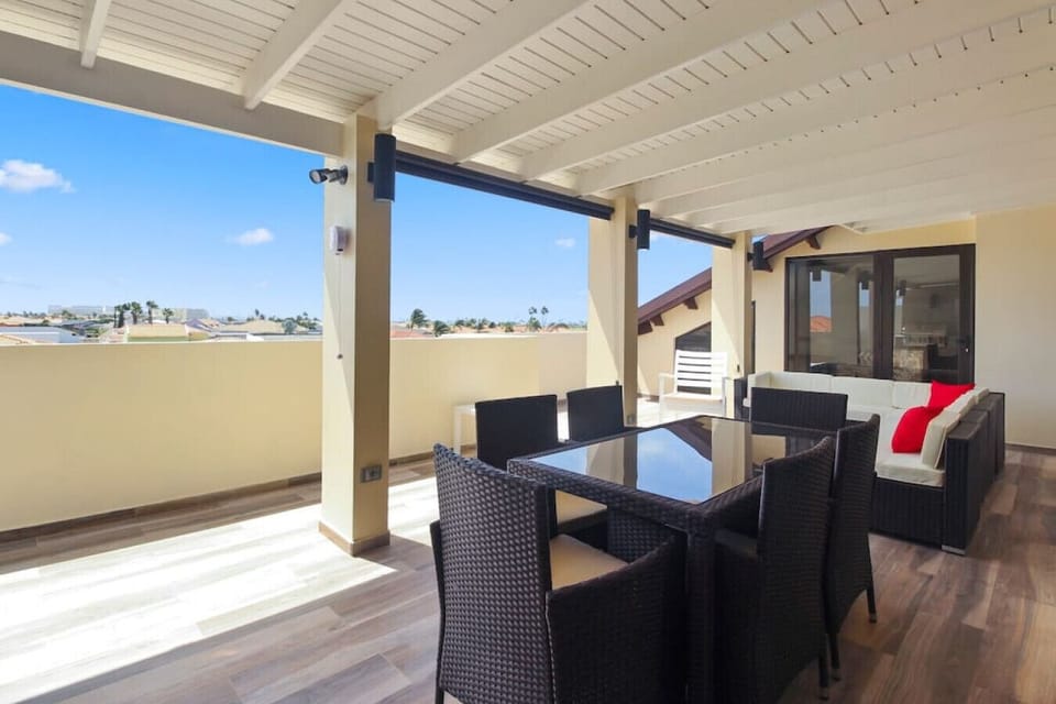 Welcome to Aruba! Enjoy the cool breeze of the Caribbean on this airy spacious terrace