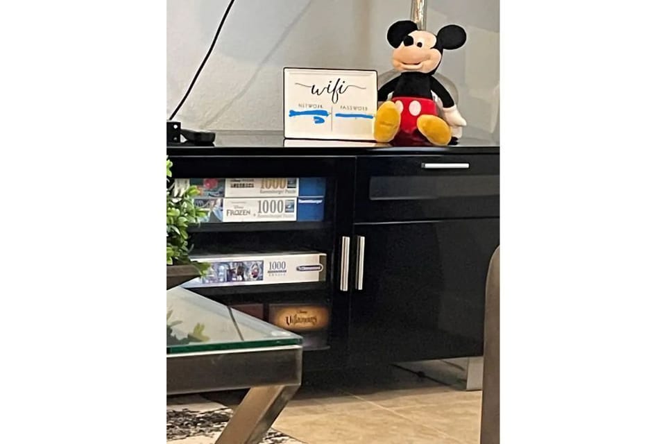 Entertainment center with Disney board games and puzzles