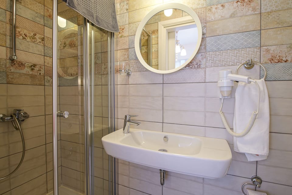 Economy Room, 1 Double Bed | Bathroom | Shower, hair dryer, towels, soap