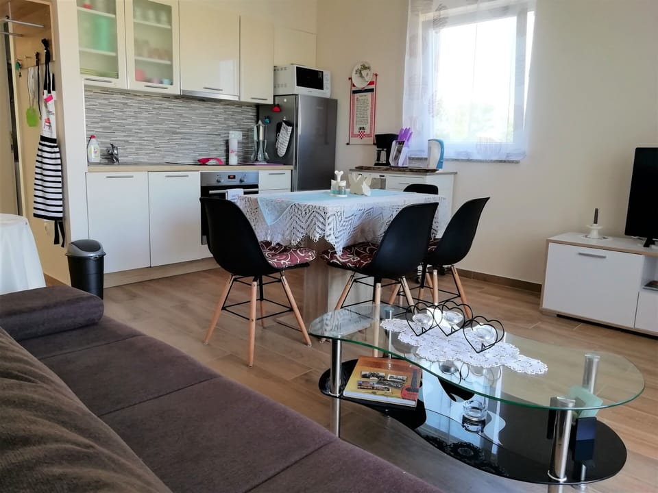 Living room, dining area, balcony