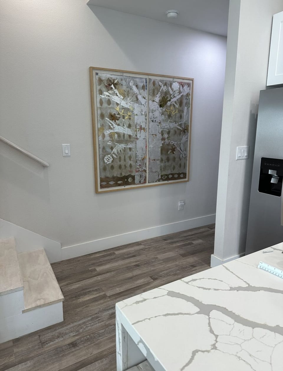 area leads to stairwell on left and downstairs master on right and w/d area