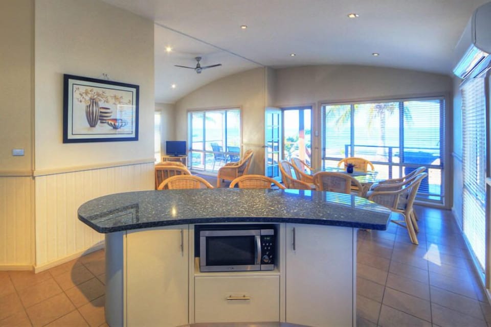 Beachfront Spa Villa (3BR) | Private kitchen | Electric kettle, dining tables
