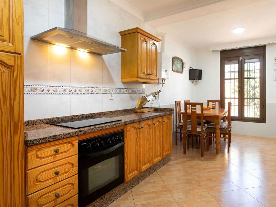Kitchen, Flooring, Countertop, Wood, Furniture, Cabinetry, Interior Design, Floor, Major Appliance, Kitchen Appliance