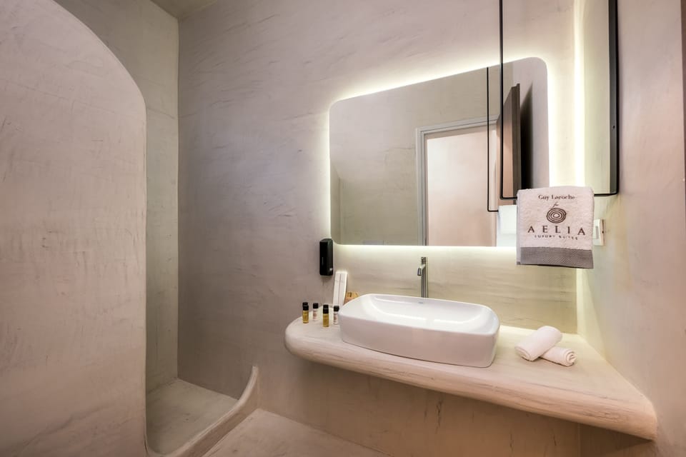 Elegant Family Suite, Sea View or Pool View | Bathroom | Shower, eco-friendly toiletries, hair dryer, bathrobes