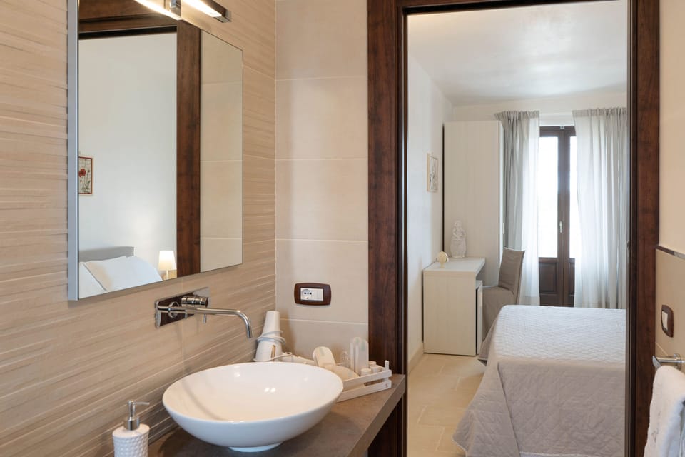 Shower, hair dryer, towels, toilet paper