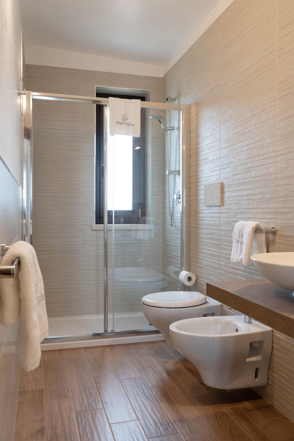 Shower, hair dryer, towels, toilet paper