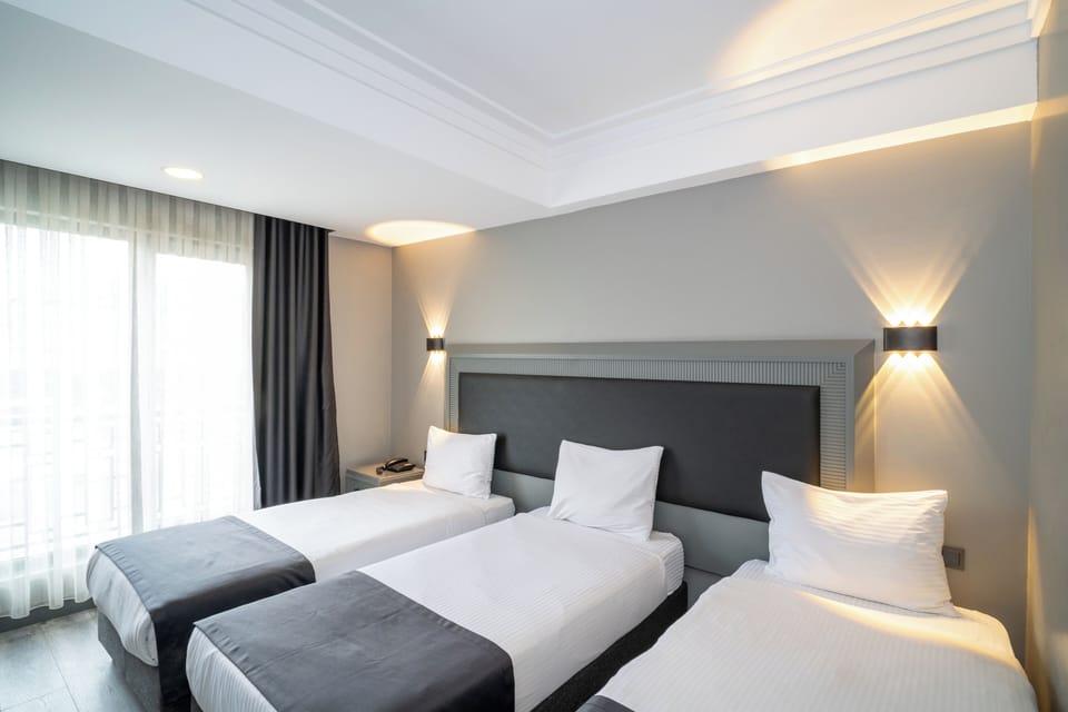 Standard Triple Room | Premium bedding, minibar, in-room safe, desk