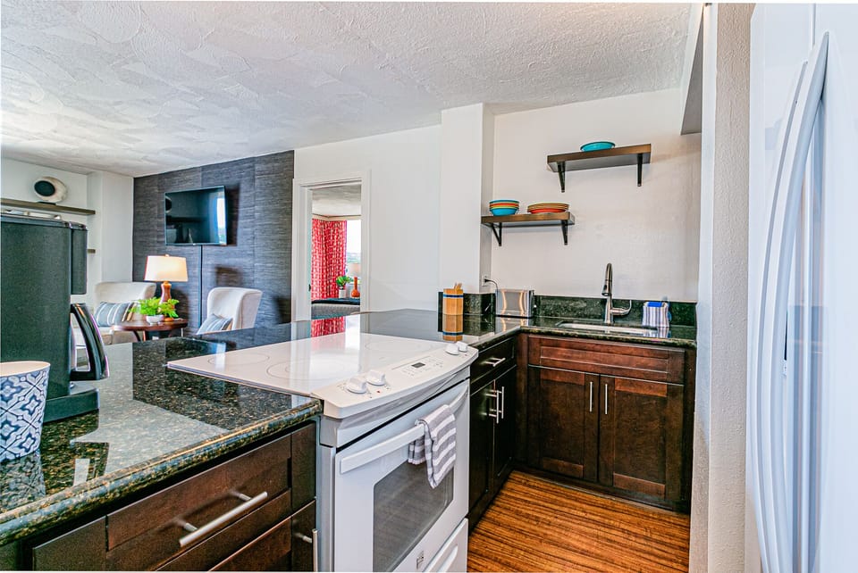 Full Kitchen with pots, pans, flatware and dishes